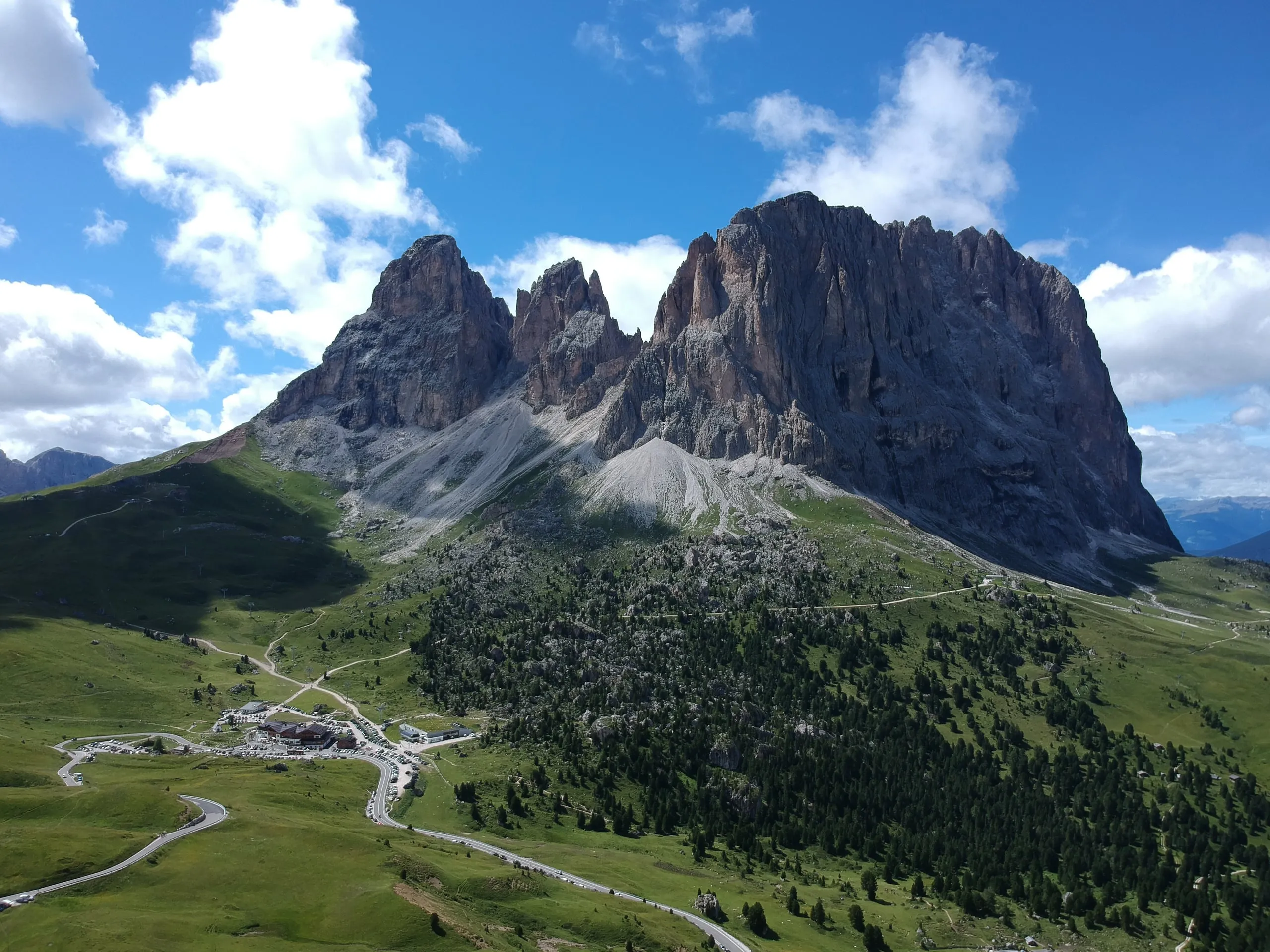 The Langkofel massif in the Dolomites above mountain meadows