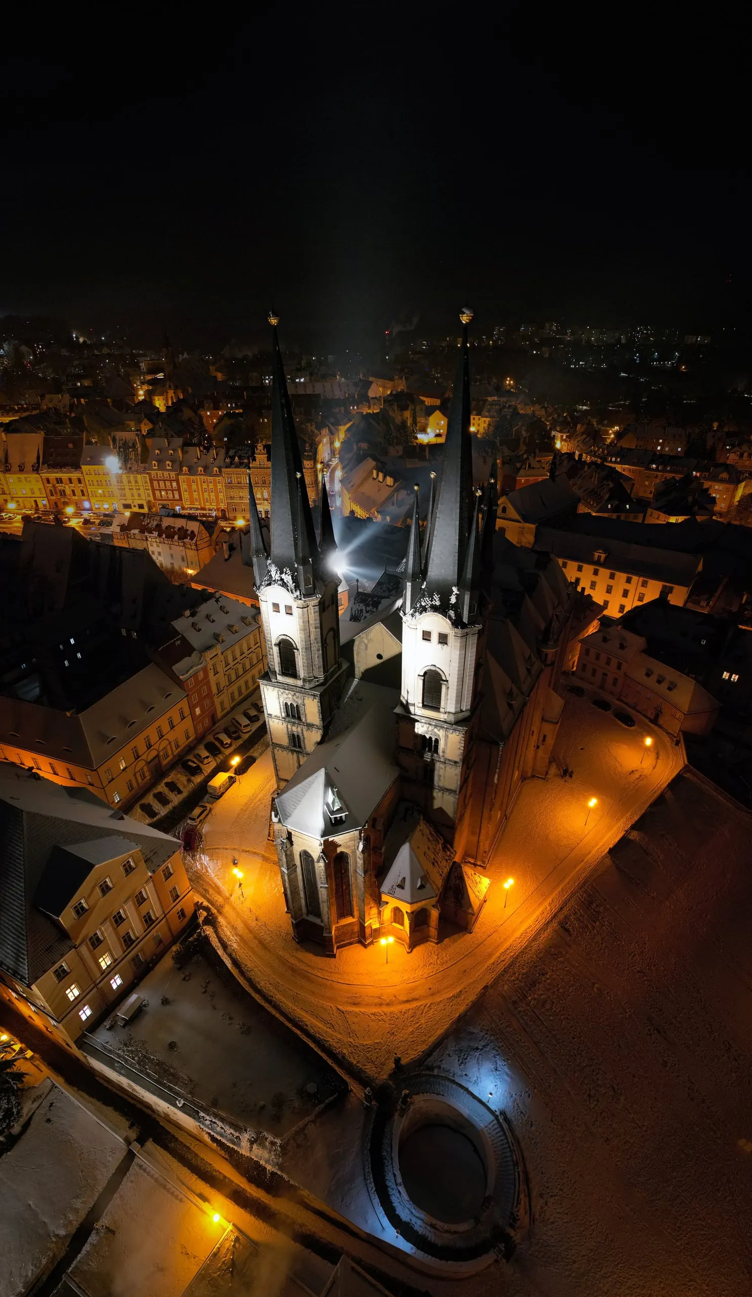 The floodlit Church of St Nicholas and St Elizabeth in Cheb at night