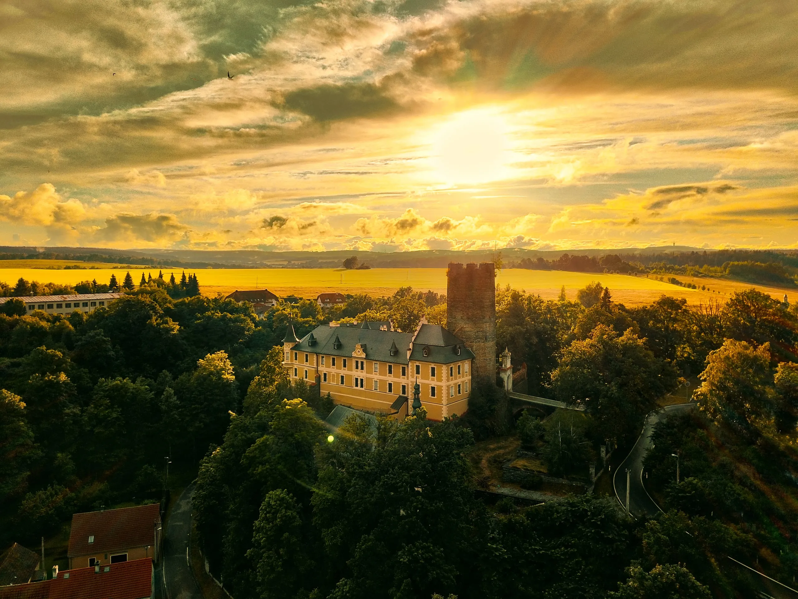Kinsberg Castle in Hrozňatov against the setting sun