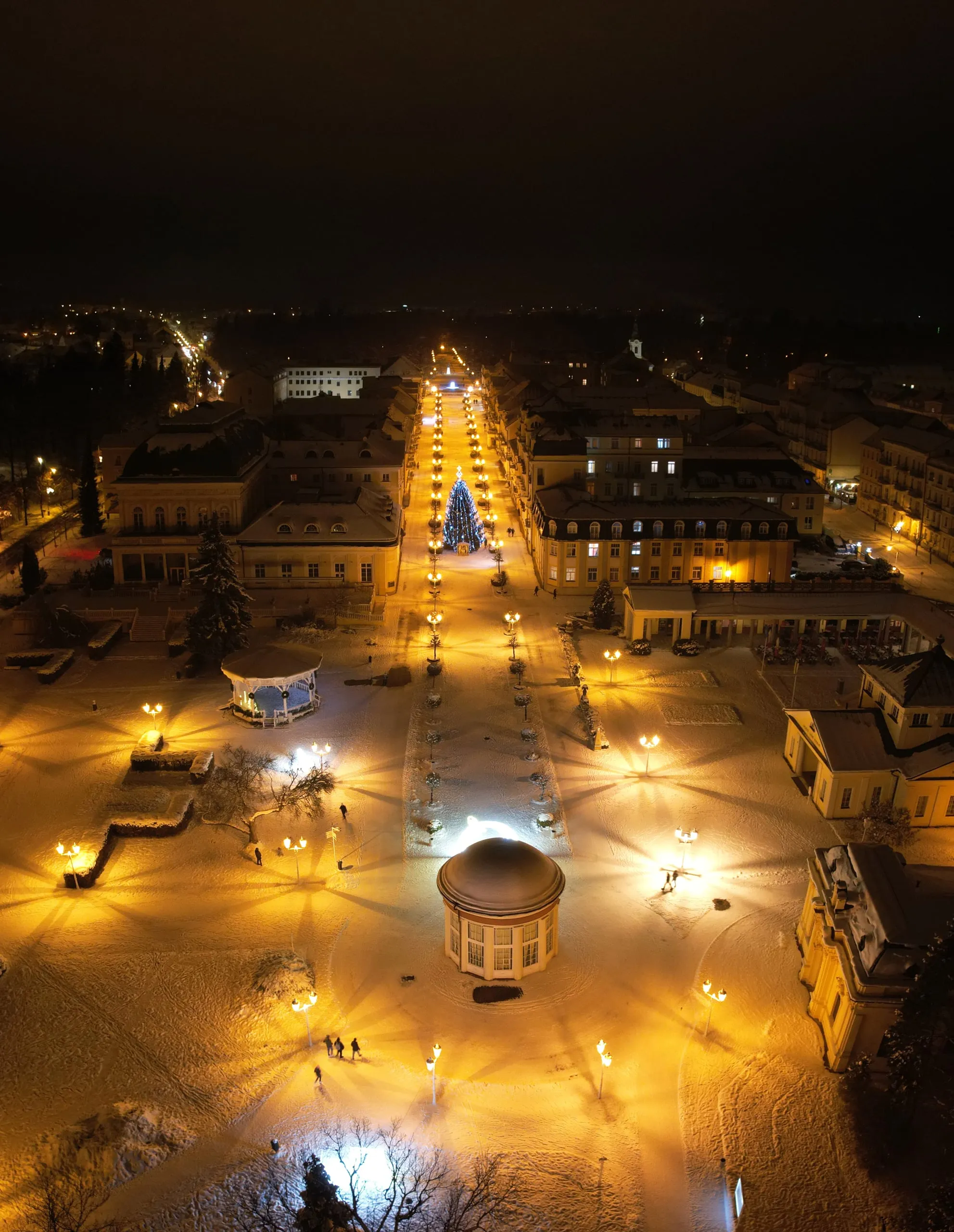 A street in Christmas lights and a pavilion in Františkovy Lázně at night